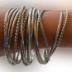 Silver tone bangles and cuff bracelets